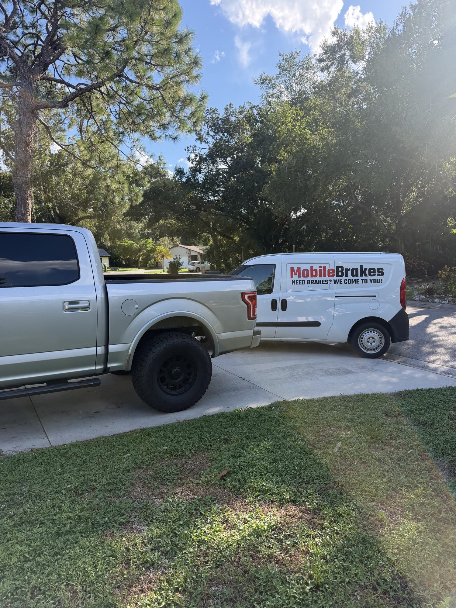 Mobile Brakes service van visiting a customer's driveway